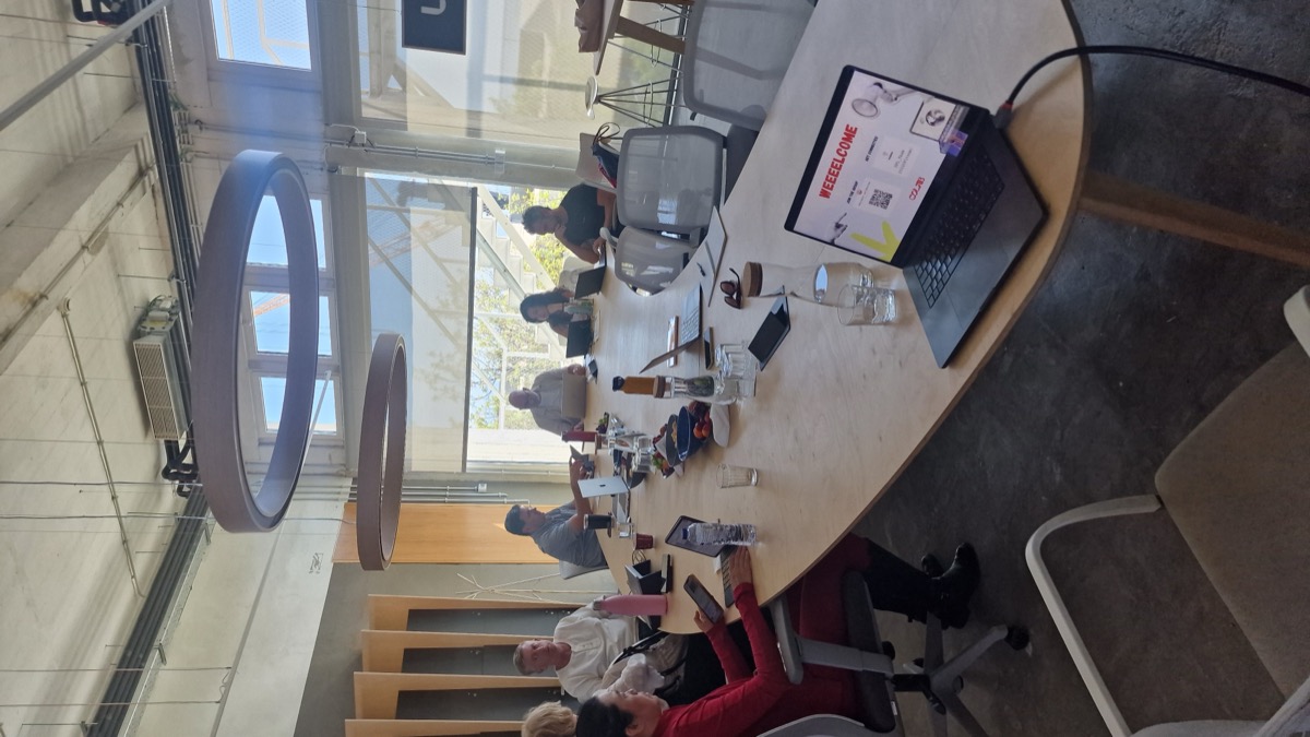 Course cohort around the table at CoLab Lisbon