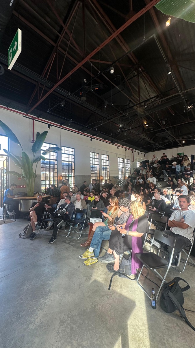Standing-room-only crowd at an AI event in Lisbon