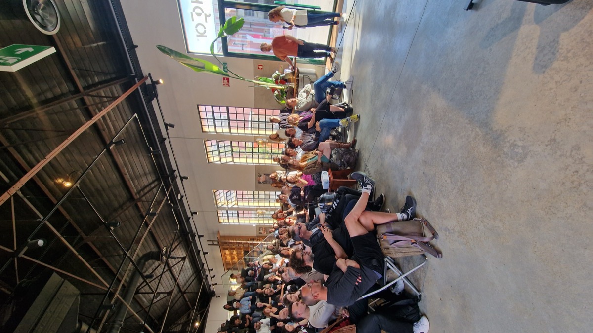 Packed industrial hall at NFC Lisbon