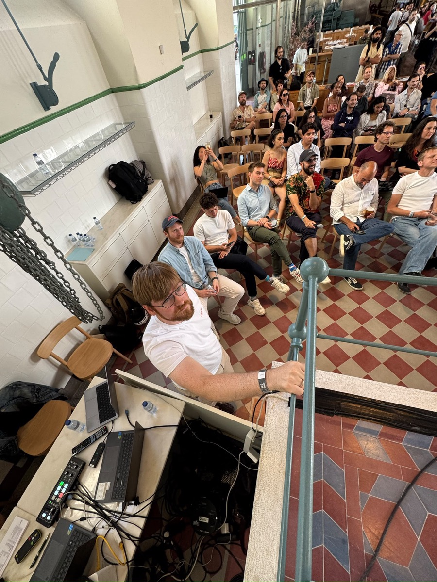 Crowd at demo day of Vibe-a-thon, the AI hackathon co-organized by Chelsea Rustrum