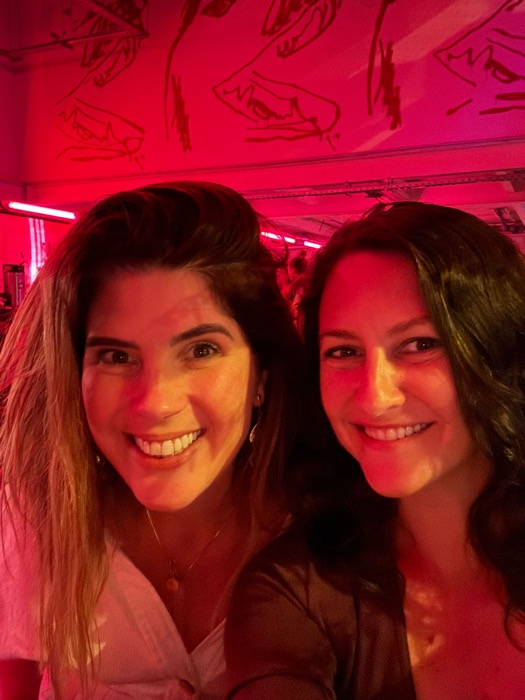 Chelsea Rustrum and a friend on a red-lit night out in Lisbon